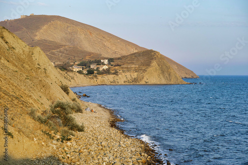 Obraz na płótnie Cape Black sea in the village of Ordzhonikidze in the Crimea, in the summer with a textured sky with clouds. And hilly terrain, landscape w salonie