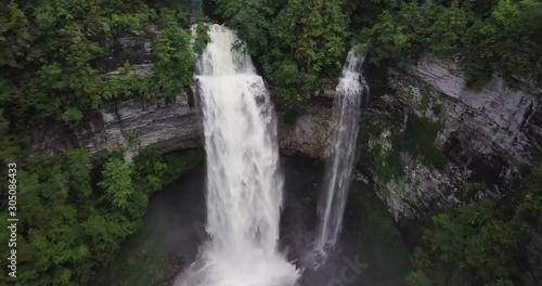 Aerial footage of a waterfall in Fall Creek Falls state park in Tennessee. The waterfall is a large tourist attraction in Tenessee. photo