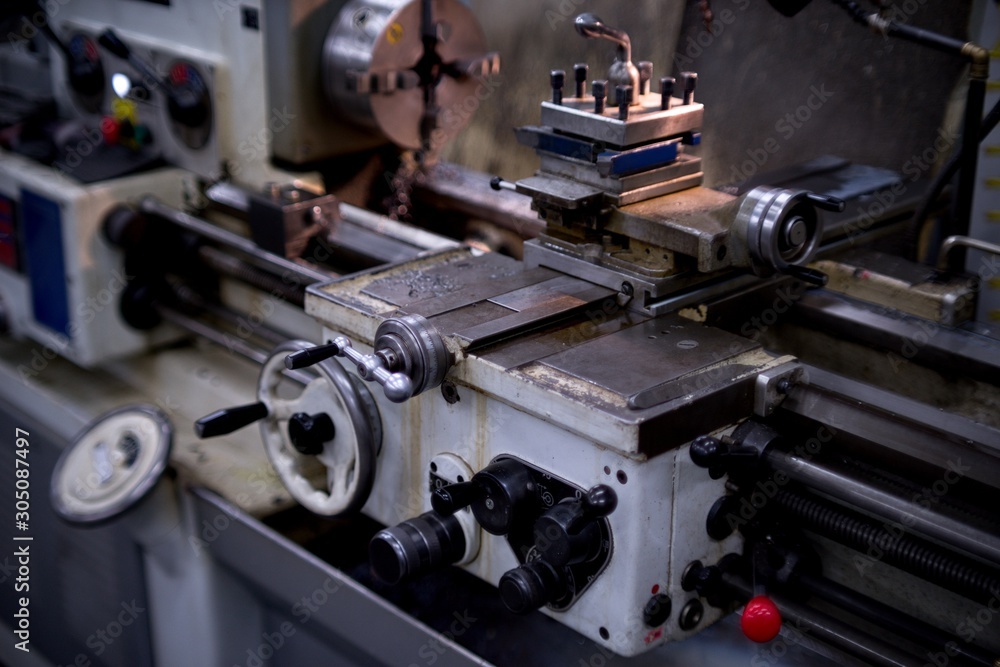 Old metal lathe machine, retro machine background. Old metal lathe machine, retro machine background.