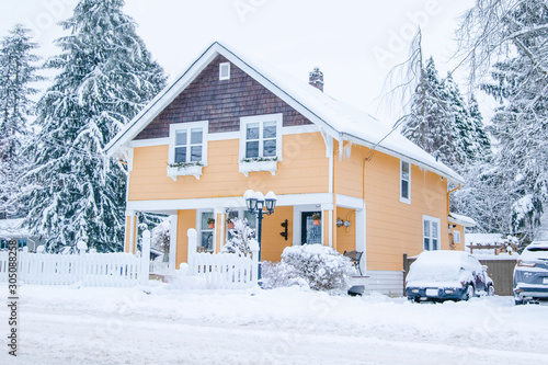 yellow house in snow