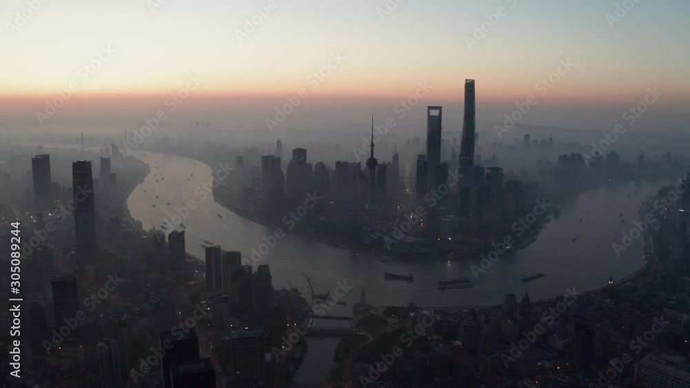 Shanghai Lujiazui business district Aerial with drone scene flyover around central of city in sunrise Shanghai Lujiazui business district Aerial with drone scene flyover around central of city in sunrise