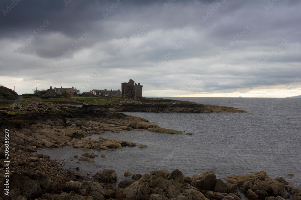 Scottish  Castle o the coast of Ayrshire in Scotland on a winters morning