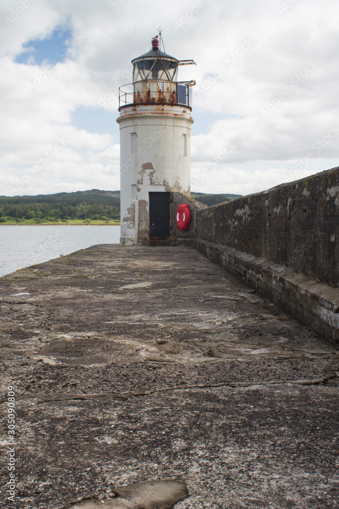 A light house in Argyle Scotland on a summers day.