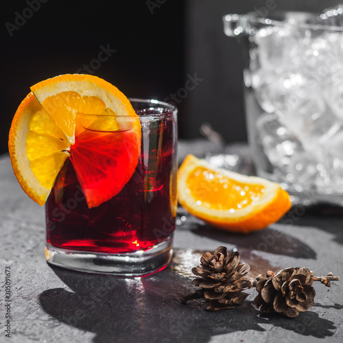 Alcohol cocktail with orange and ice bucket