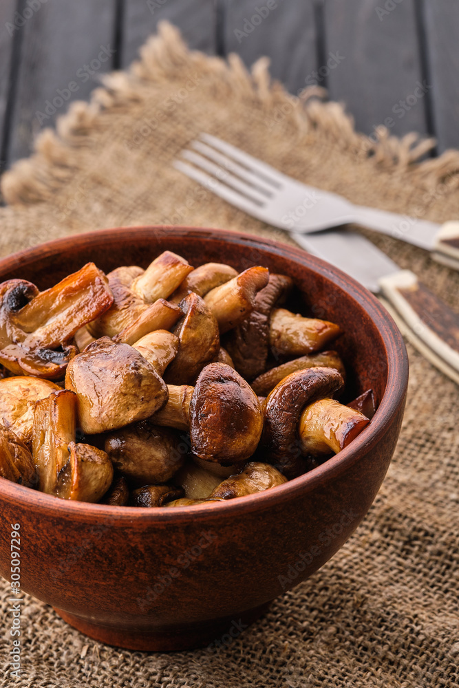 Clay plate with roasted mushrooms