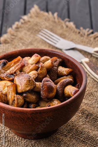 Clay plate with roasted mushrooms