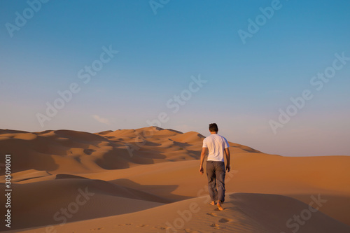 UAE. Man in desert © erainbow