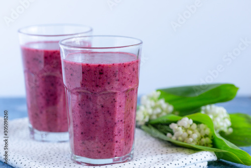 Fresh morning beetroot smoothie in a glass. Healthy vegan or vegetarian breakfast, seasonal detox, clean eating, alcaline diet, weight loss food concept. Space for text.