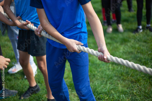 Children pull the rope. Outdoor sports.