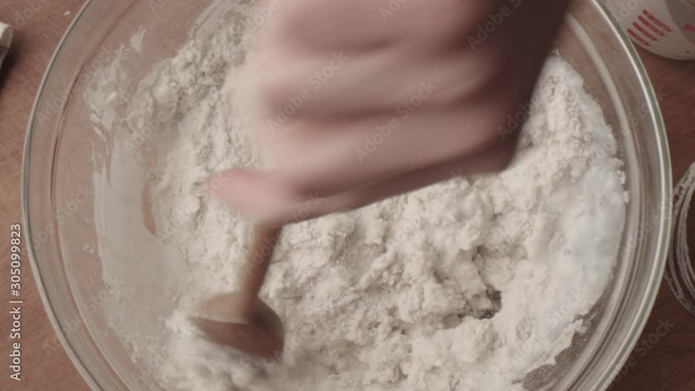 Overhead Shot Mixing Flour and Milk in a Glass Bowl with Sound Overhead Shot Mixing Flour and Milk in a Glass Bowl with Sound