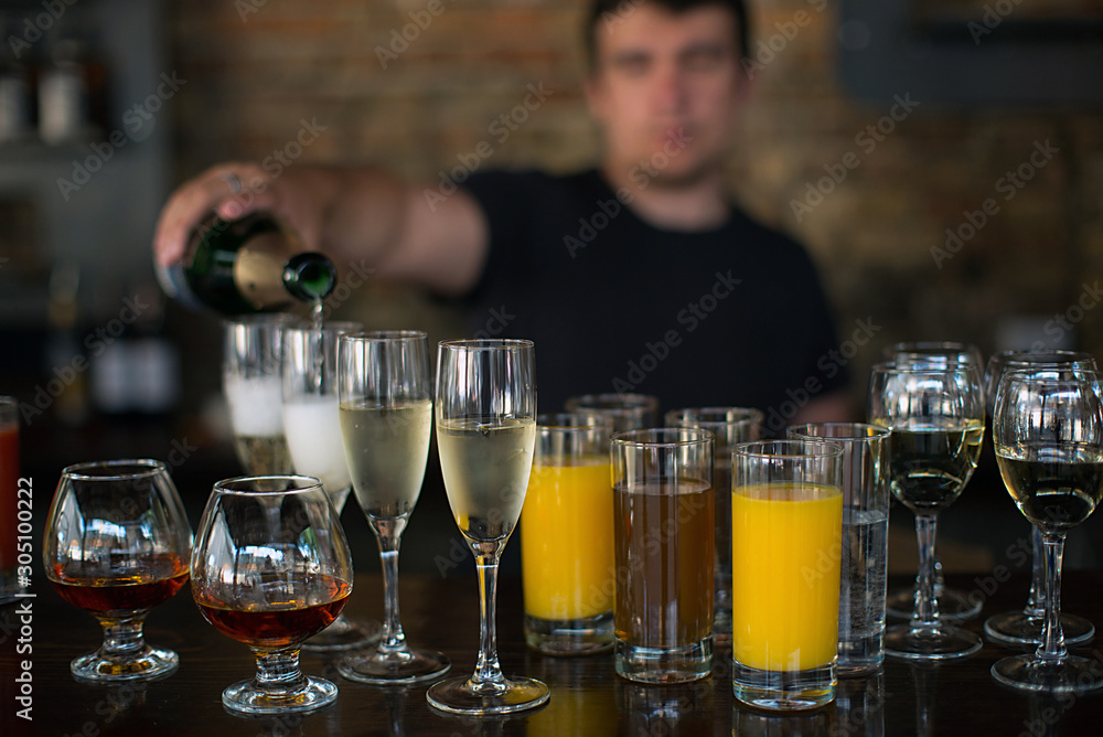 bartender pours drinks bartender pours drinks