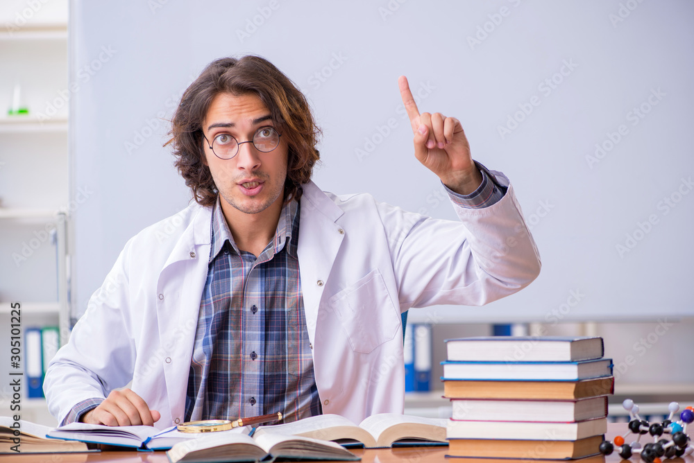 Chemistry lecturer during lecture in college Chemistry lecturer during lecture in college