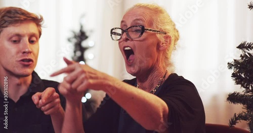 Grandma argues and yells her side in a game of cards over holidays - slow motion - shot on RED