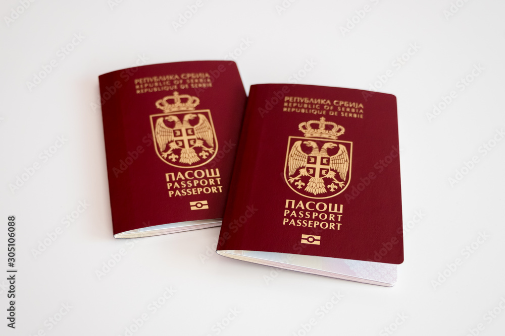 Two Serbian passports on white background, selective focus, conceptual