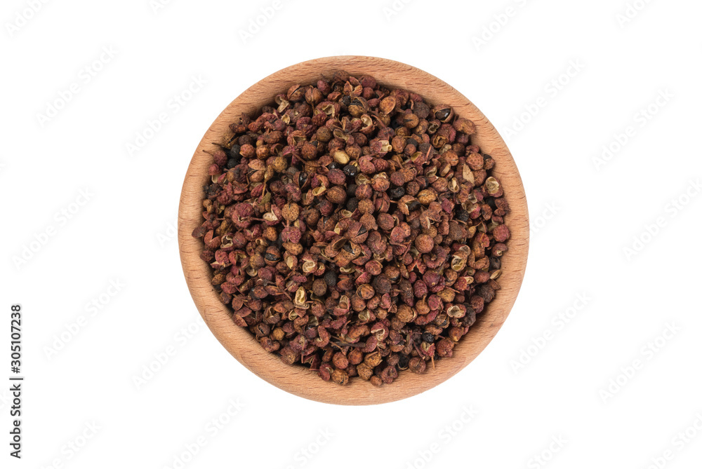 sichuan pepper in wooden bowl isolated on white background. top view. spices and food ingredients sichuan pepper in wooden bowl isolated on white background. top view. spices and food ingredients