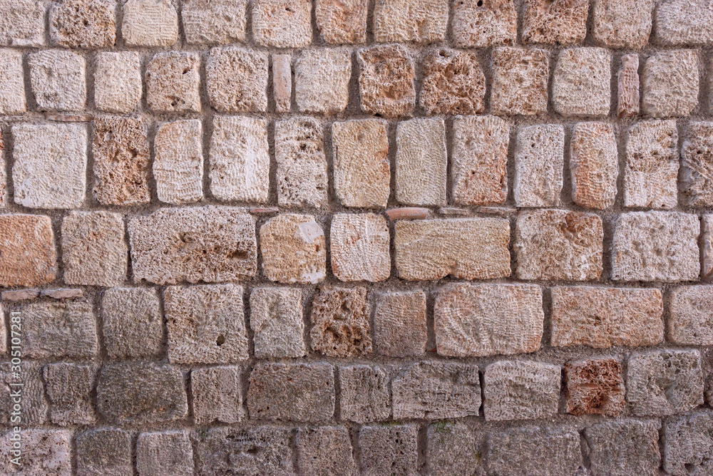 Old limestone sandstone wall. Abstract background wall texture. Old vintage wall. Wall texture for architecture.