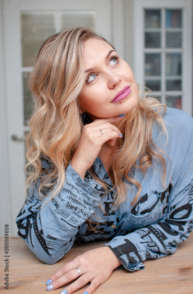portrait of a young blonde woman with blue eyes portrait of a young blonde woman with blue eyes