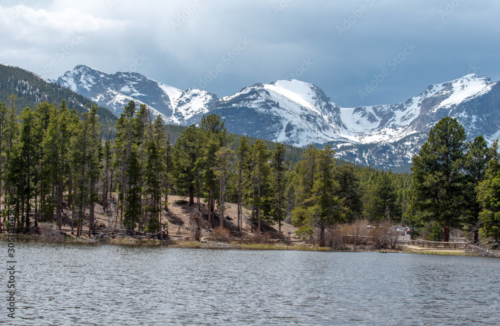 Rocky Mountain National Park landscape of Sprague Lake, trees and snow covered mountains Rocky Mountain National Park landscape of Sprague Lake, trees and snow covered mountains