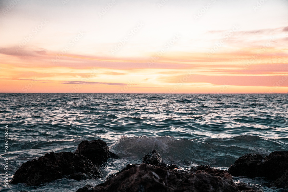 Golden Sunset Over Choppy Tropical Waters