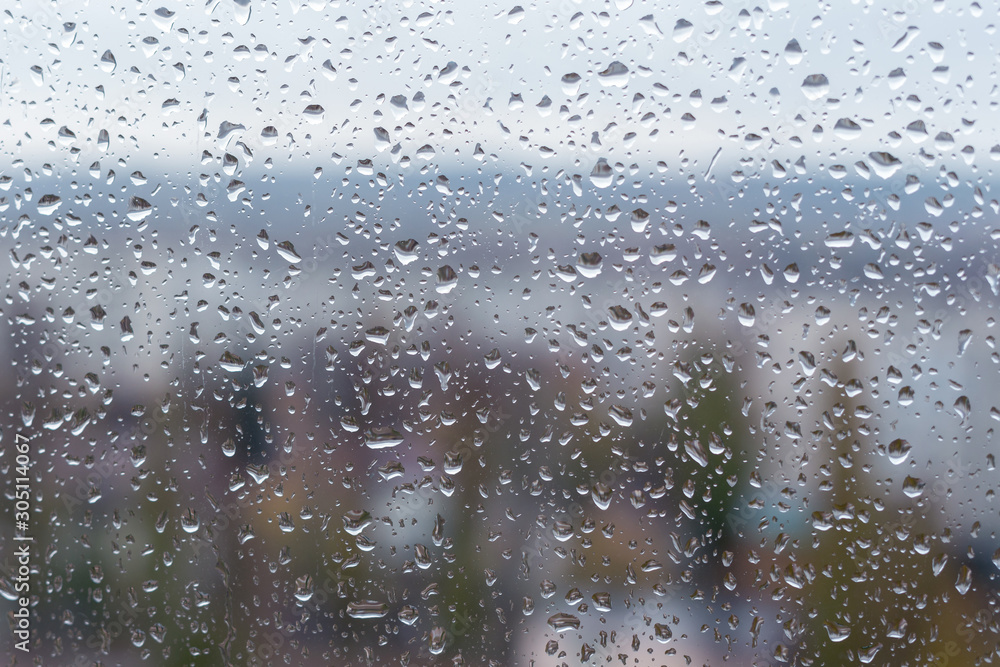 Raindrops on window glass surface, background texture Raindrops on window glass surface, background texture