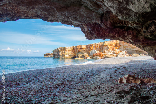 Fototapeta Naklejka Na Ścianę i Meble -  Beach of Spilies or Kitrenosi with sea caves near Rethimno, Crete, Greece.