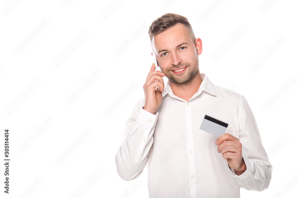 smiling businessman talking on smartphone and holding credit card isolated on white smiling businessman talking on smartphone and holding credit card isolated on white