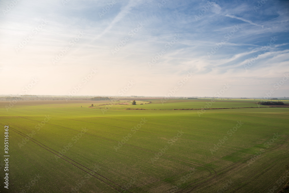 Panorama of beautiful fields in South Bohemian Moravian Tuscany, czech republic, nice blue sky with sun in the evening.