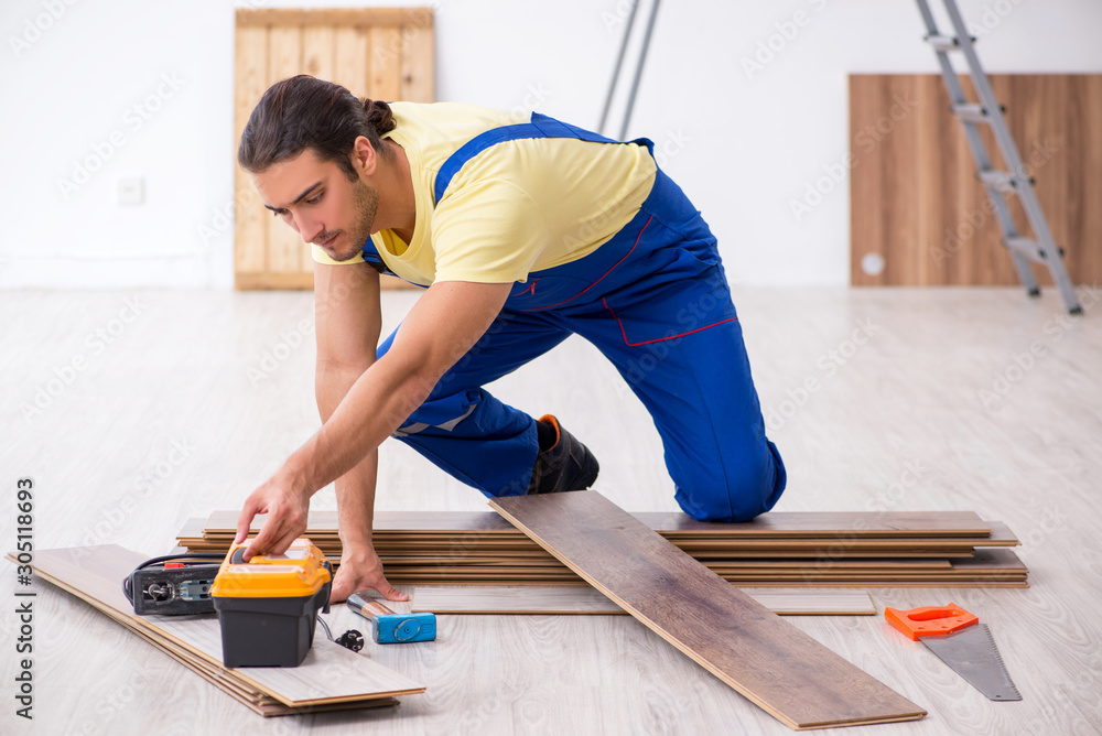 Young male contractor working indoors Young male contractor working indoors
