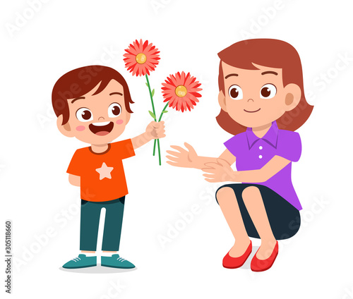 happy cute kid boy give flower to mother