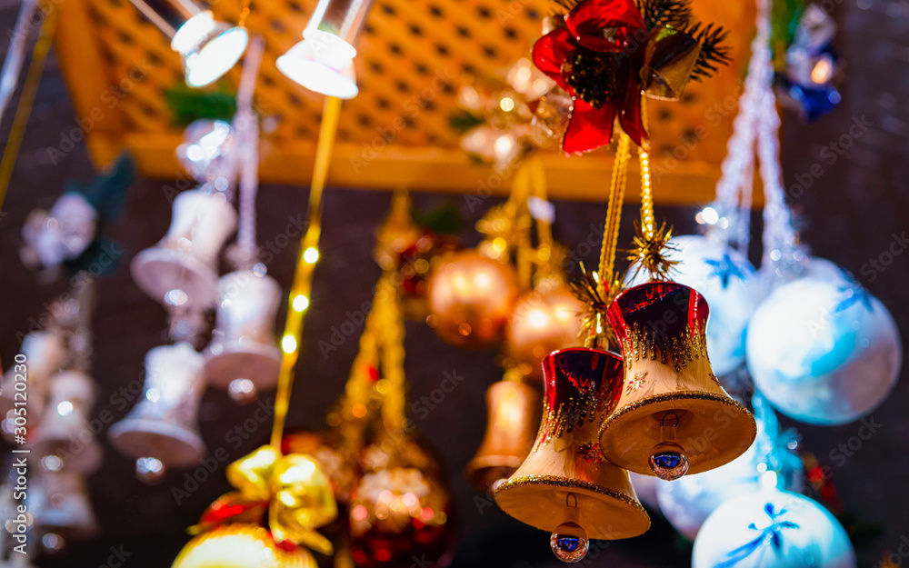 Naklejka premium Christmas Tree Decoration on Christmas Market at Alexanderplatz in Winter Berlin, Germany. Advent Fair Decoration, and Stalls with Crafts Items in Bazaar. Made of glass