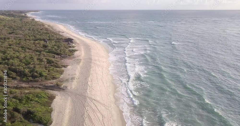 Drone video of waves hitting the beach on the Indian Ocean on the Swahili coast, Tanzania. Drone video of waves hitting the beach on the Indian Ocean on the Swahili coast, Tanzania.