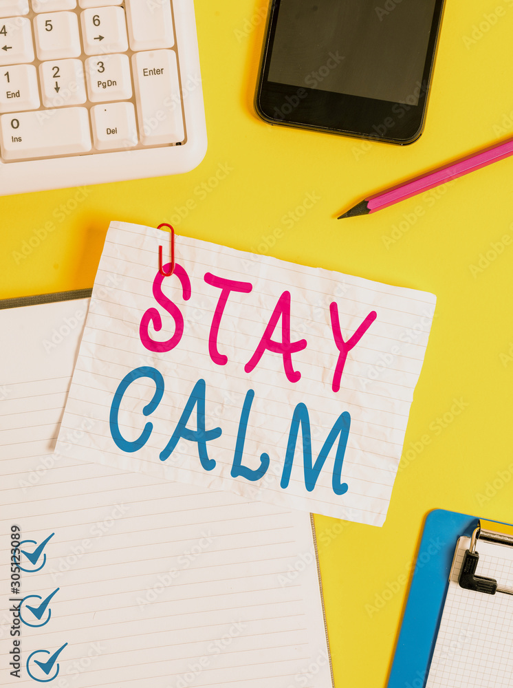 Writing note showing Stay Calm. Business concept for Maintain in a state of motion smoothly even under pressure Crumpled white paper on table paper clips clock mobile and pc keyboard Writing note showing Stay Calm. Business concept for Maintain in a state of motion smoothly even under pressure Crumpled white paper on table paper clips clock mobile and pc keyboard