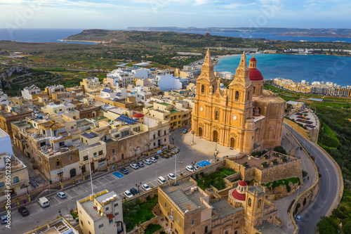Aerial view of The Parish Church in Melieha city. Blue sky, sea, day. Winter. Malta island photo