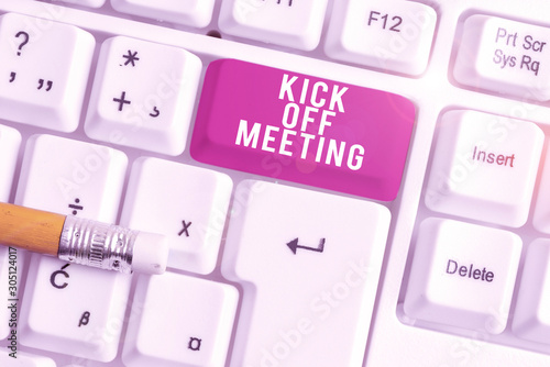 Handwriting text writing Kick Off Meeting. Conceptual photo getting fired from your team private talking about company White pc keyboard with empty note paper above white background key copy space photo