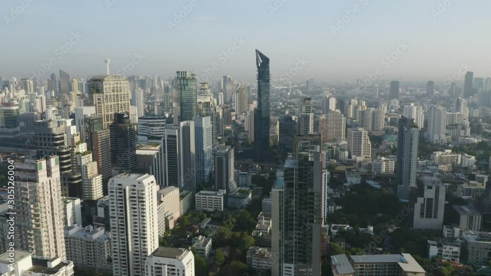 The aerial view from a drone of the center of Bangkok at Phrom Phong and Asok area with high rise buildings of offices, condominiums and modern hotels. The aerial view from a drone of the center of Bangkok at Phrom Phong and Asok area with high rise buildings of offices, condominiums and modern hotels.