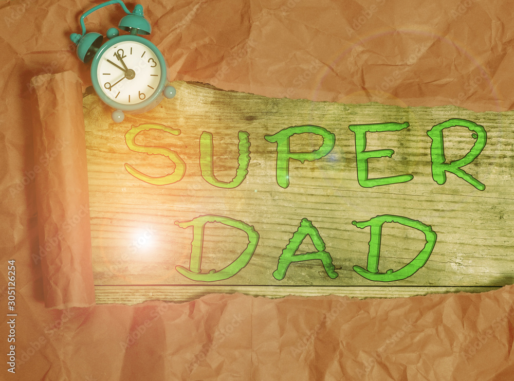 Writing note showing Super Dad. Business concept for Children idol and super hero an inspiration to look upon to Alarm clock and torn cardboard on a wooden classic table backdrop Writing note showing Super Dad. Business concept for Children idol and super hero an inspiration to look upon to Alarm clock and torn cardboard on a wooden classic table backdrop