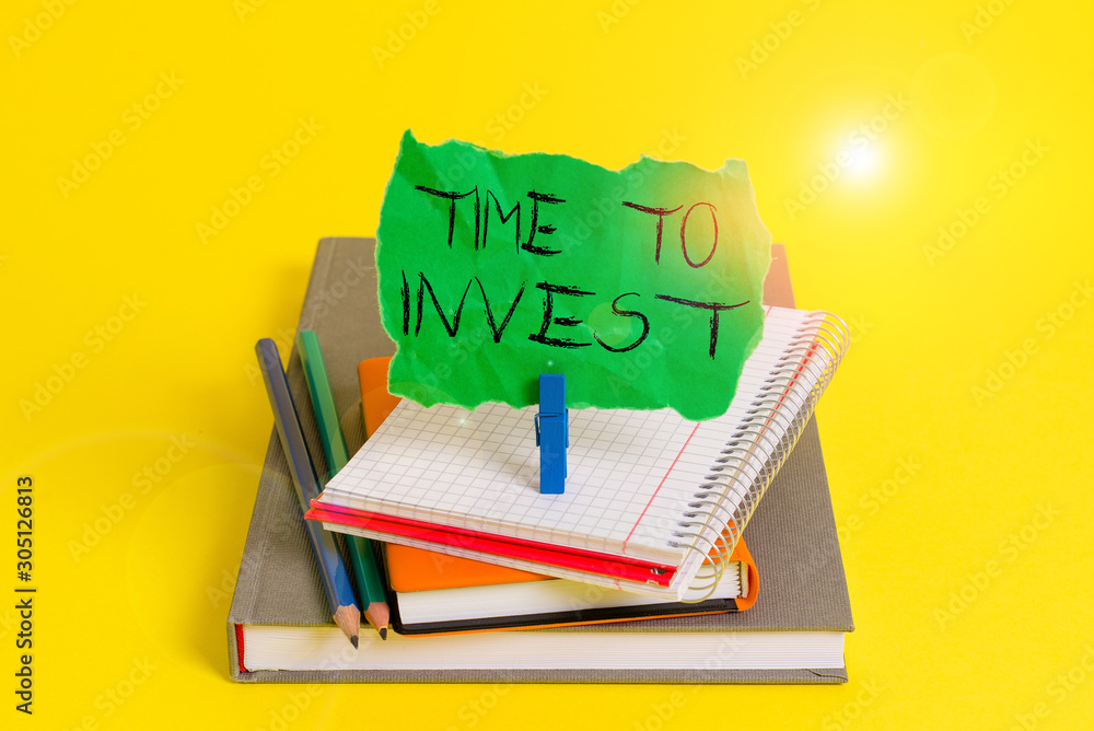 Text sign showing Time To Invest. Business photo showcasing Creation of  capital capable of producing other goods Book pencil rectangle shaped  reminder notebook clothespin office supplies Stock Photo | Adobe Stock