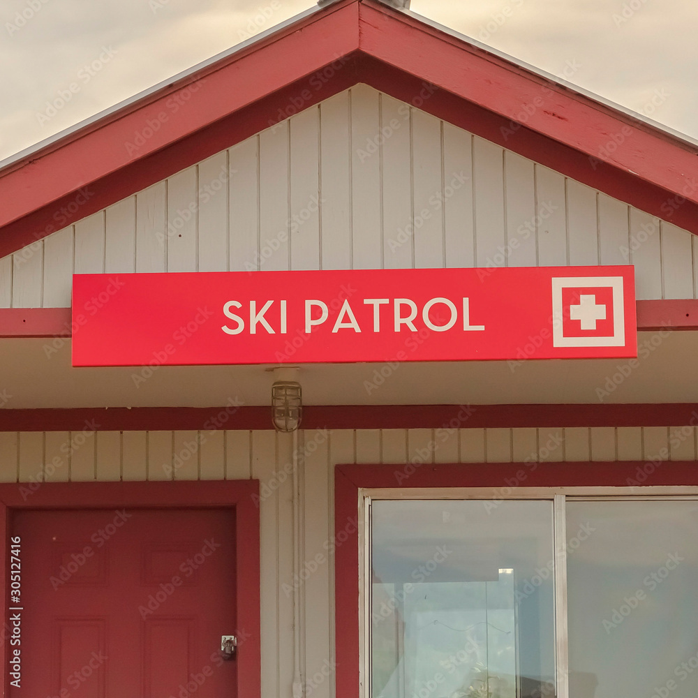 Square frame Wooden building with Ski Patrol sign in Park City ski resort viewed in summer