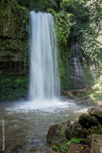 Fototapeta Naklejka Na Ścianę i Meble -  Mahua Waterfall is a plunge type waterfall located in Patau Village, Tambunan District of Sabah, Malaysia within the Crocker Range National Park administered by Sabah Parks.