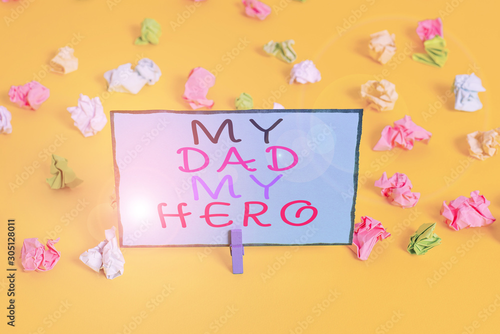 Text sign showing My Dad My Hero. Business photo showcasing Admiration for your father love feelings emotions compliment Colored crumpled papers empty reminder white floor background clothespin