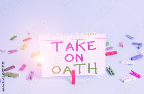 Word writing text Take On Oath. Business photo showcasing A solemn appeal to a deity Speak the truth Make a Promise Colored clothespin rectangle square shaped paper light blue background