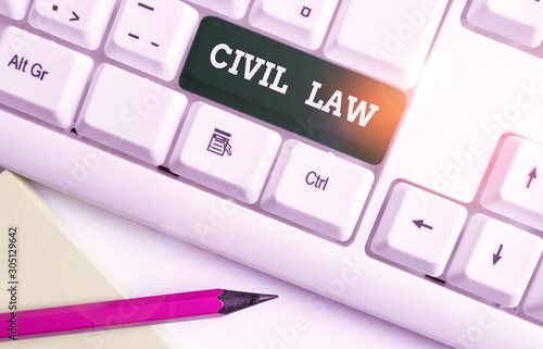 Writing note showing Civil Law. Business concept for Law concerned with private relations between members of community White pc keyboard with note paper above the white background photo