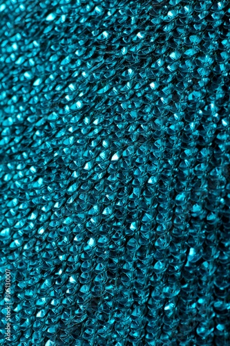Fabric with sequins and sequins of bright colors. Fashion glitter fabric, sequins. Shiny surface
