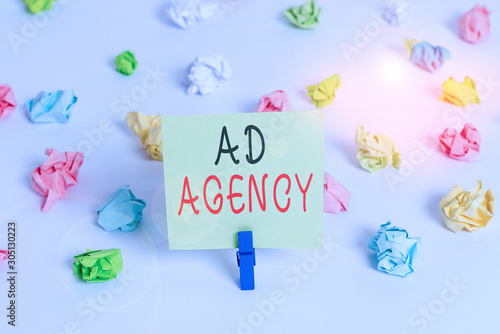 Word writing text Ad Agency. Business photo showcasing business dedicated to creating planning and handling advertising Colored crumpled papers empty reminder white floor background clothespin