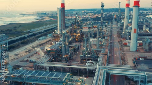 Aerial view of petrochemical oil refinery (refining complex). Oil and gas tanks with fuming pipes on the plant (factory) photo