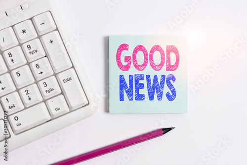 Handwriting text Good News. Conceptual photo Someone or something positive Encouraging uplifting or desirable White pc keyboard with empty note paper and pencil above white background