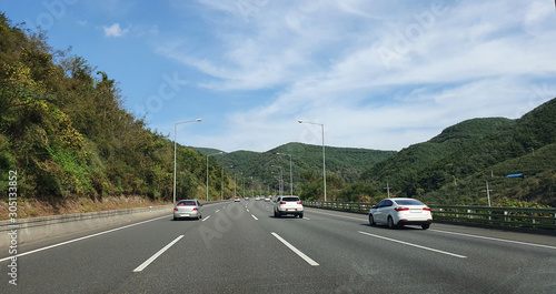 a motorized highway in Korea. the back of a running car.