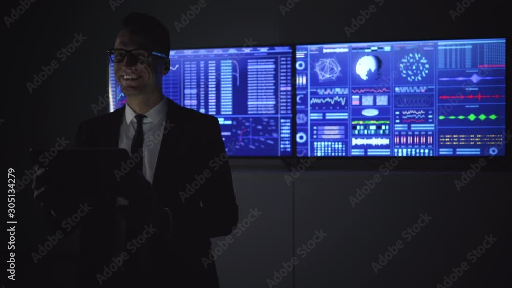 The smiling businessman with tablet in his hands The smiling businessman with tablet in his hands