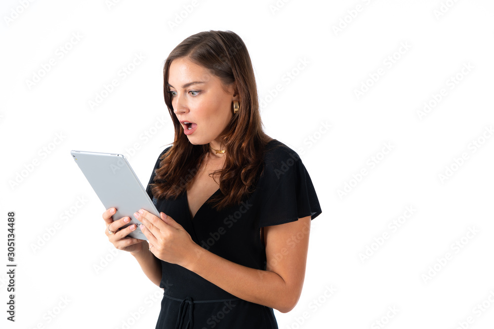 Young women in black dress hand holding tablet with white background Young women in black dress hand holding tablet with white background