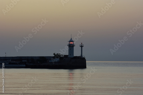View of the lighthouse of the sea port of Yalta